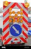 direction-arrow-sign-signaling-traffic-diversion-at-safety-warning-trailer-2C2G4D5.jpg