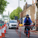 Car frame around bike showing road hogging